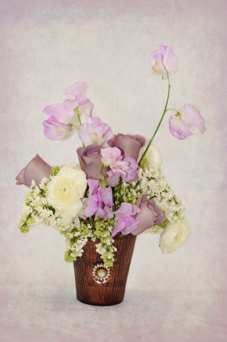 Lavender sweet pea and andromeda japonica centerpiece