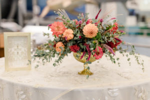 Sweetheart table centerpiece in a gold compote