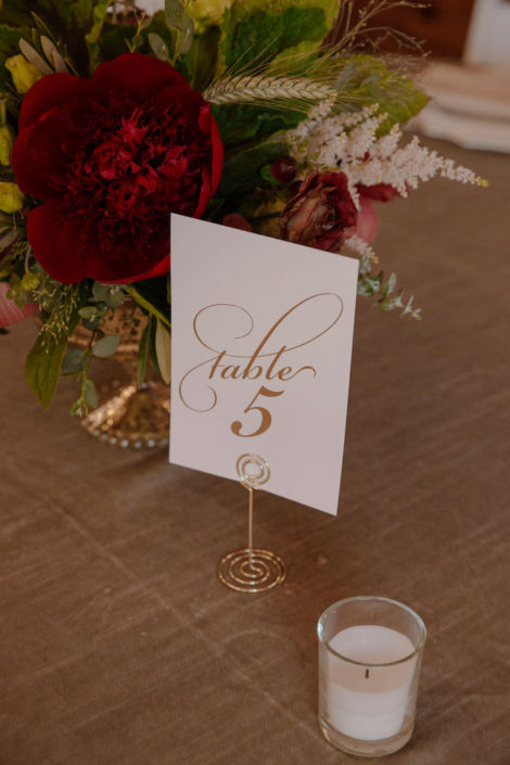 gold-table-number-maroon-centerpiece