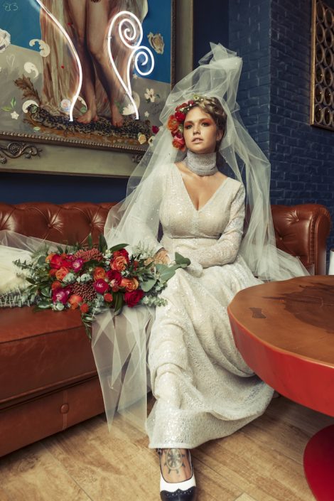 bride-sitting-red-flowers-vidrio-raleigh-durham-florist