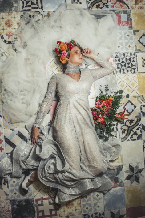 bride-lying-down-portrait-fun-colorful-bouquet-durham-florist
