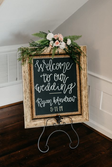 Wedding sign with accent floral design by durham wedding florist
