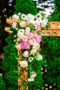 Blush pink and white wedding ceremony arbor at The Sutherland. Flowers by Poppy Belle Floral Design, Durham florist.
