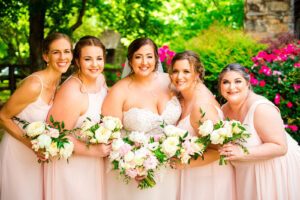Bridesmaids in blush pink dressed with bride. All bouquets designed by Poppy Belle Floral, Durham, NC florist.